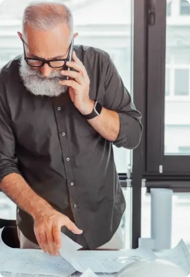 A senior citizen on the phone with a Clover Professional