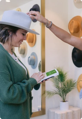 A man using Clover Flex in a clothing and accessories store