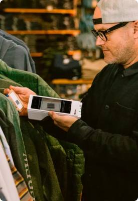 A man using Clover Flex in a clothing and accessories store