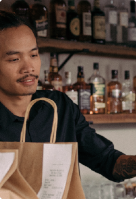 A man using Clover Flex in a wine and liquor store