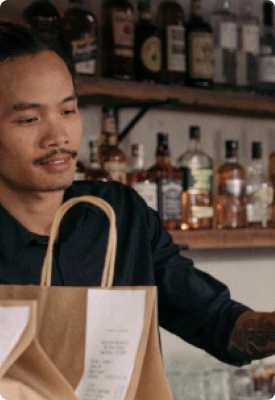 A man using Clover Flex in a wine and liquor store