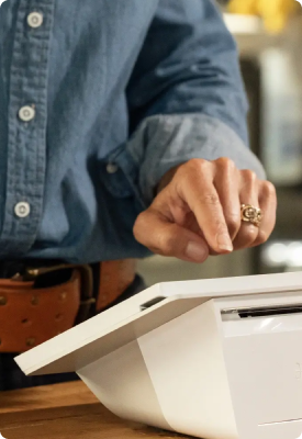 A man using Clover Flex in a clothing and accessories store