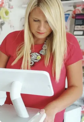A woman using Clover Solo in a service-based business